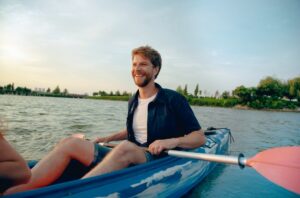 Sports for all level of activities man-maneuvering-in-water-while-kayaking